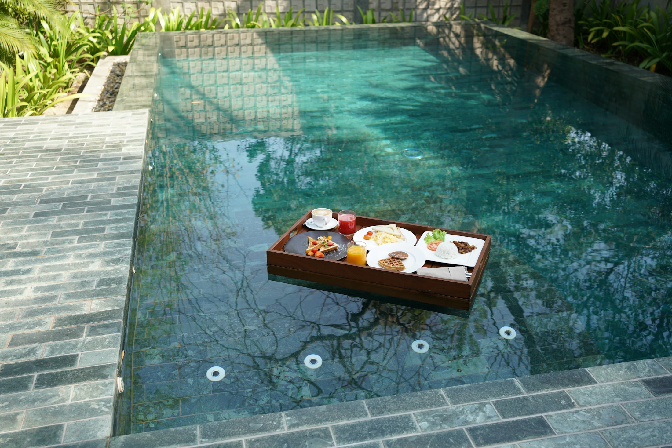 Floating breakfast by a resort pool